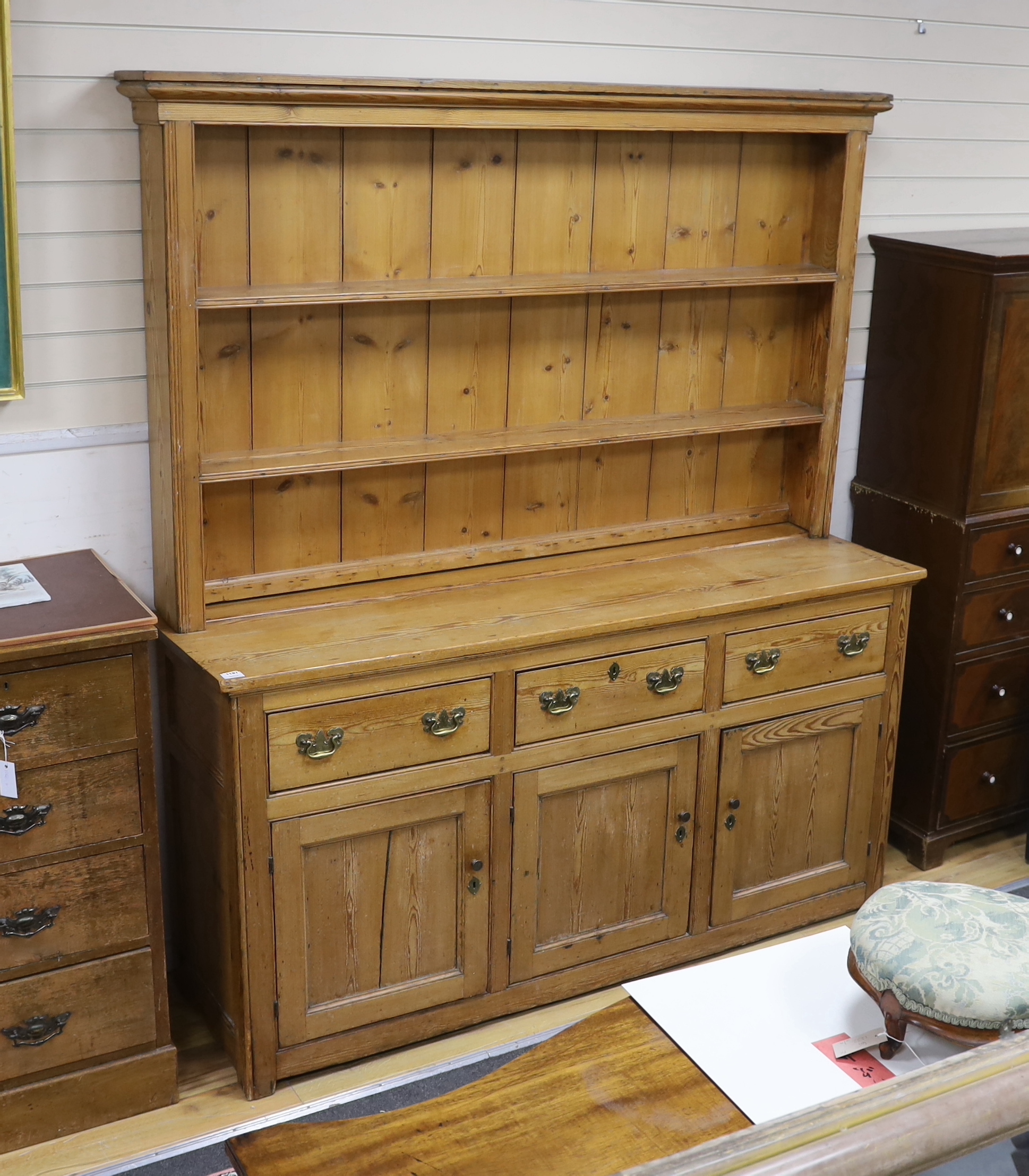 A Victorian pine dresser with boarded rack, width 181cm, depth 51cm, height 206cm